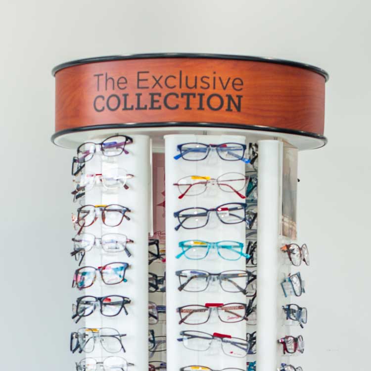 A retail tower with eyeglasses placed on it
